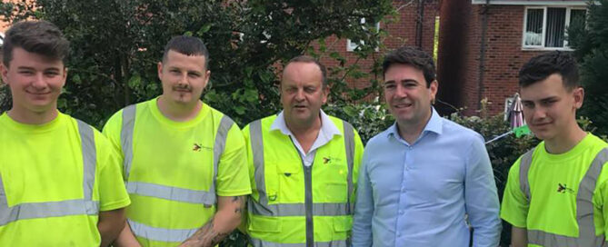 Manchester Mayor Andy Burnham underlined his green credentials on Wednesday 15th May 2019 by officially opening a health community allotment in Stockport. The allotment project in Woodley first took roots about two years ago when local couple, David and Julie Ashton, were helped through their own medical problems by their GPs Health Champions. They were so impressed at what the Alvanley Family Practice Health Champions were doing that they decided that wanted to give something back. As keen gardeners they wanted to use the skills and experience they had, and with the backing of their fellow Champs, they hit on the idea of a community allotment and so the project began. Stockport Council pitched in by giving them, for free, a much-neglected allotment plot and The George Cox Foundation initially created the basic infrastructure for the allotments out of some very overgrown land. The foundation was approached again this year by the residents for some further help and it was seen as a great opportunity to provide on-the-job training for our Apprentices. The requirement was to provide pedestrian access around the site using a combination of paving and tarmac. This gave the apprentices the chance to learn about levels, designs, block paving and surfacing techniques. The allotment committee have given fantastic feedback regarding their attitude, commitment to the project and the finished result. David commented "It's a great space for local people to use and is adding to the real sense of community that we already have in Woodley thanks to the Health Champions. You don't have to be a patient of the Alvanley Family Practice to come here everyone is welcome. Officially opening the allotment Andy Burnham said "The Alvanley Family Practice with their Health Champions are showing us the future of primary care. We love the NHS but for it to survive in the future it needs to provide more than medication and projects like this community allotment show just what can be achieved." Alvanley Family Practice's Dr Mark Gallagher said "Today is not about the practice but rather about our amazing community. We have nothing but pride and admiration for our wonderful volunteers who, by freely giving their time and dedication, are creating something for everyone to be a part of." Plans for the allotment include a multi-purpose large shed, with plumbed in facilities, which will be used for a variety of Champion run community activities. This is being funded by a £10,000 grant from Stockport Council's Local Fund.